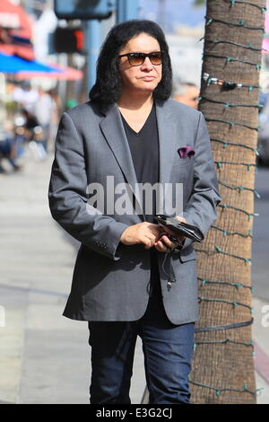 Gene Simmons seen leaving Panini Cafe in Beverly Hills. He goes to his car to show the photographers an award he was recently given, The Charles Durning Award. Gene then poses for a picture with a young fan and gives the fan his sunglasses for the shot. Stock Photo