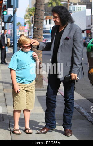 Gene Simmons seen leaving Panini Cafe in Beverly Hills. He goes to his car to show the photographers an award he was recently given, The Charles Durning Award. Gene then poses for a picture with a young fan and gives the fan his sunglasses for the shot. Stock Photo