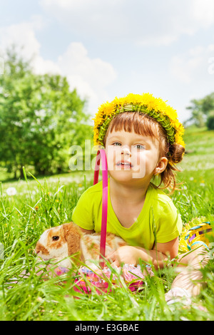 Happy girl wearing flowers circlet and rabbit Stock Photo