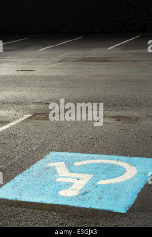 Space reserved for handicapped drivers in an empty car parking Stock Photo