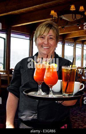 Waitress with tray Bloody Caesar & iced tea drinks Stock Photo