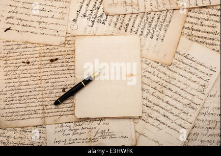 Fountain pen on antique letters and empty sheet Stock Photo