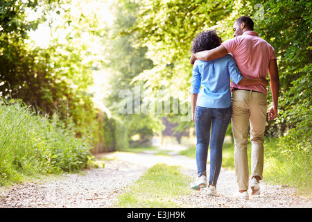Young African American Couple Walking In Countryside Stock Photo
