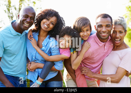 Multi Generation African American Family Standing In Garden Stock Photo