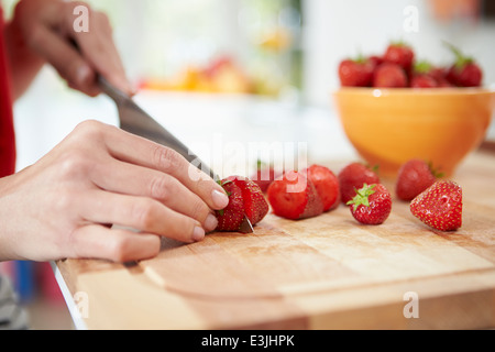 Close Up Of Woman Preparing Fruit Salad Stock Photo