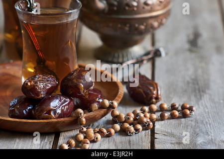 Traditional arabic tea with dry madjool dates and rock sugar nabot ...