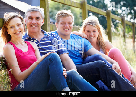 Teenage Family Relaxing On Walk In Countryside Stock Photo