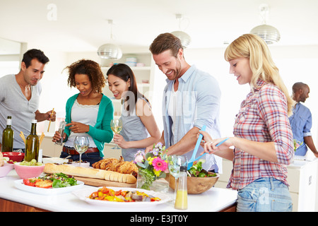 Group Of Friends Having Dinner Party At Home Stock Photo