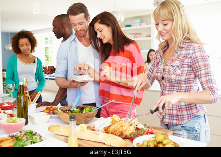 Group Of Friends Having Dinner Party At Home Stock Photo