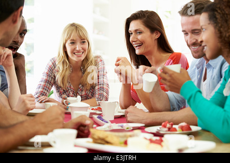 Group Of Friends Having Cheese And Coffee Dinner Party Stock Photo