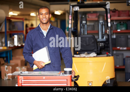 Portrait Of Engineer Standing In Factory Stock Photo