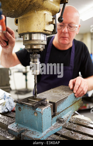 Engineer Operating Milling Machine In Factory Stock Photo
