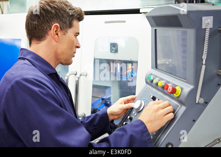 Engineer Operating Computer Controlled Milling Machine Stock Photo