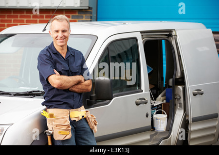 Plumber Or Electrician Standing Next To Van Stock Photo