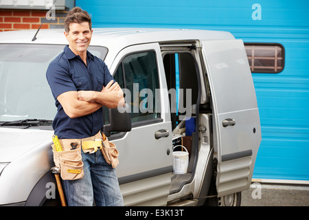 Plumber Or Electrician Standing Next To Van Stock Photo