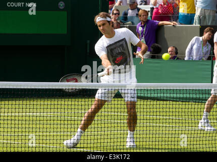 Wimbledon, London, UK. 24th June, 2014.  Picture shows Roger Federer (SUI) on day two of Wimbledon Tennis Campionships 2014 warming up before his 1st round match with Paolo Lorenzi (ITA) on No.1 Court. Credit:  Clickpics/Alamy Live News Stock Photo
