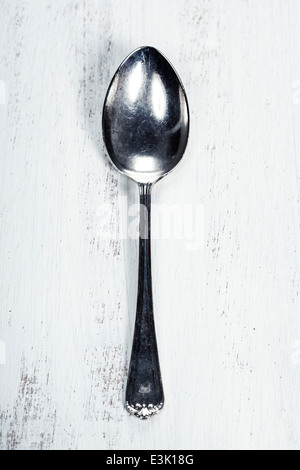 Metal spoon on wooden background Stock Photo