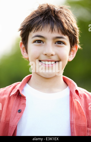 Portrait Of Smiling Hispanic Boy In Countryside Stock Photo