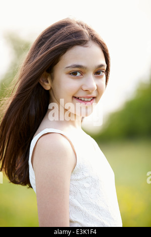 Portrait Of Smiling Hispanic Girl In Countryside Stock Photo