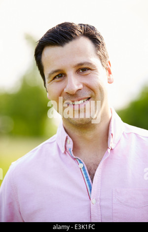 Portrait Of Smiling Hispanic Man In Countryside Stock Photo