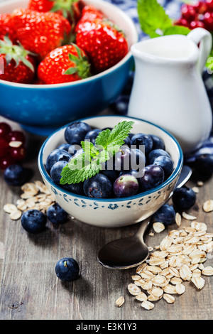 Healthy layered dessert with muesli and berries on table Stock Photo ...