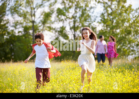 Hispanic Family Walking In Countryside Stock Photo