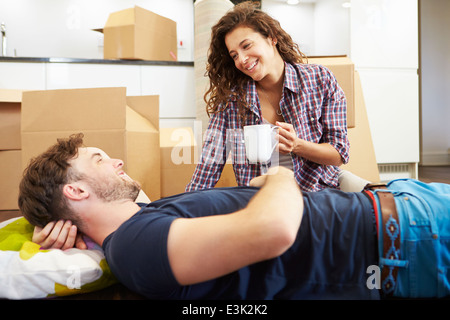Couple Taking A Break During House Move Stock Photo