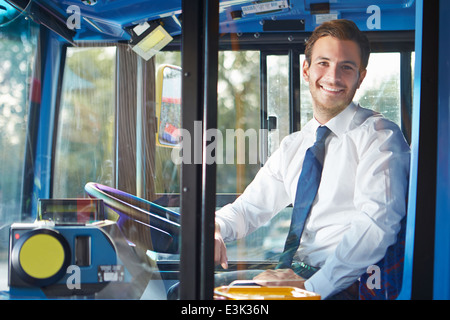 Portrait Of Bus Driver Behind Wheel Stock Photo