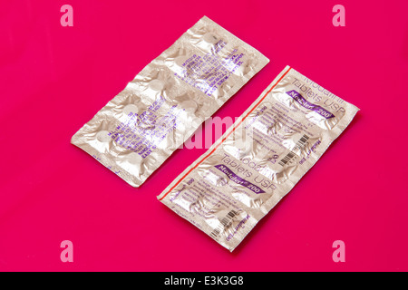 Modafinil, Modalet 200 tablets or pills on a bright pink background. Stock Photo