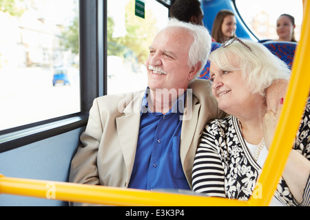 Senior Couple Enjoying Journey On Bus Stock Photo