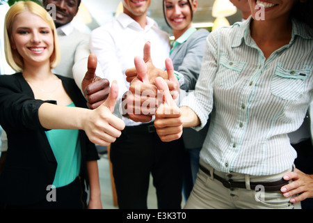 cheerful business group giving thumbs up Stock Photo