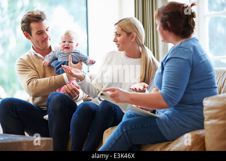 Social Worker Visiting Family With Young Baby Stock Photo