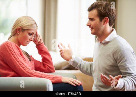 Young Couple Having Argument At Home Stock Photo