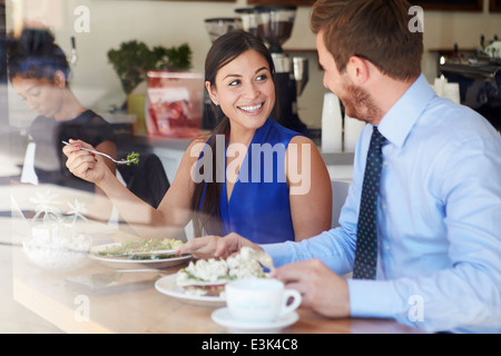 Two Businesspeople Meeting For Lunch In Coffee Shop Stock Photo