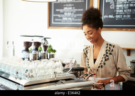 Female Owner Of Coffee Shop Stock Photo