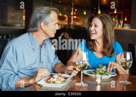 Mature Couple Enjoying Meal At Outdoor Restaurant Stock Photo