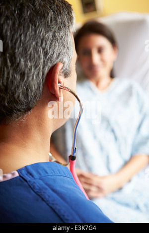 Close Up Of Male Doctor Using Stethoscope Stock Photo