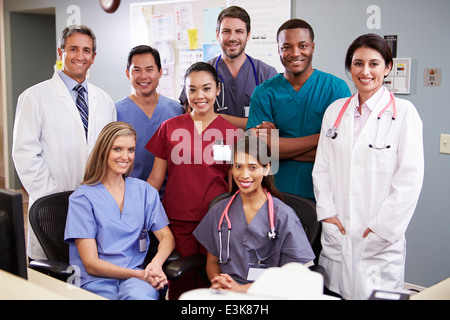 Portrait Of Medical Team At Nurses Station Stock Photo