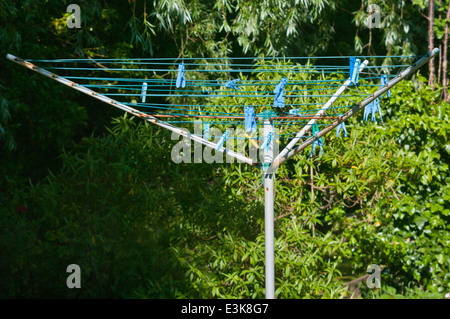 Empty Rotary Clothes Line With Pegs On Stock Photo