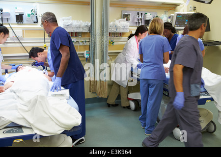 Medical Team Working On Patient In Emergency Room Stock Photo