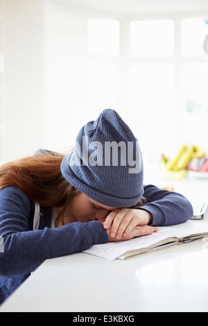 Depressed Girl Studying At Home Stock Photo