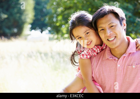 Portrait Of Asian Father And Daughter In Countryside Stock Photo