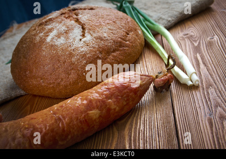 Composition with salami sausages with fresh country bread .farm-style Stock Photo