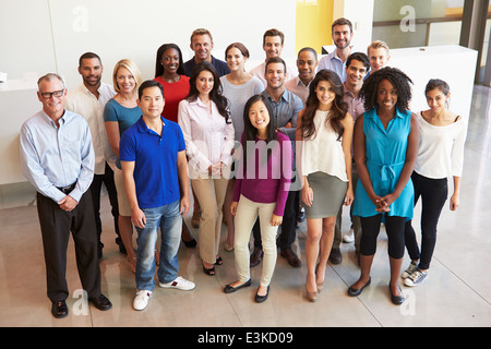 Portrait Of Multi-Cultural Office Staff Standing In Lobby Stock Photo