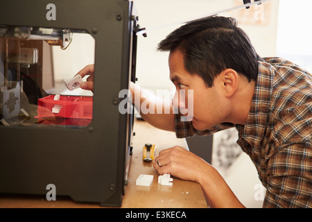 Male Architect Using 3D Printer In Office Stock Photo