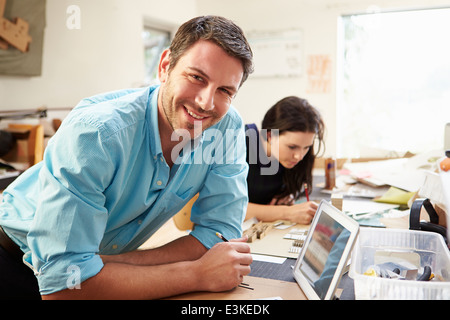 Two Architects Making Models In Office Using Digital Tablet Stock Photo