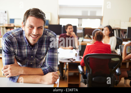 Portrait Of Male Architect With Meeting In Background Stock Photo
