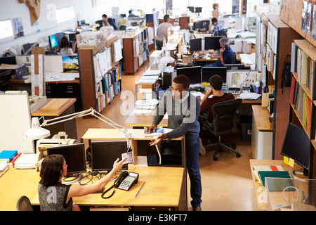 Interior Of Busy Architect's Office With Staff Working Stock Photo