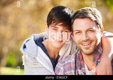 Portrait Of Father And Son In Countryside Stock Photo