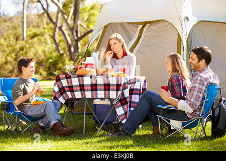 Family Enjoying Camping Holiday In Countryside Stock Photo